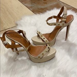 Carrano off white gold studded heels.